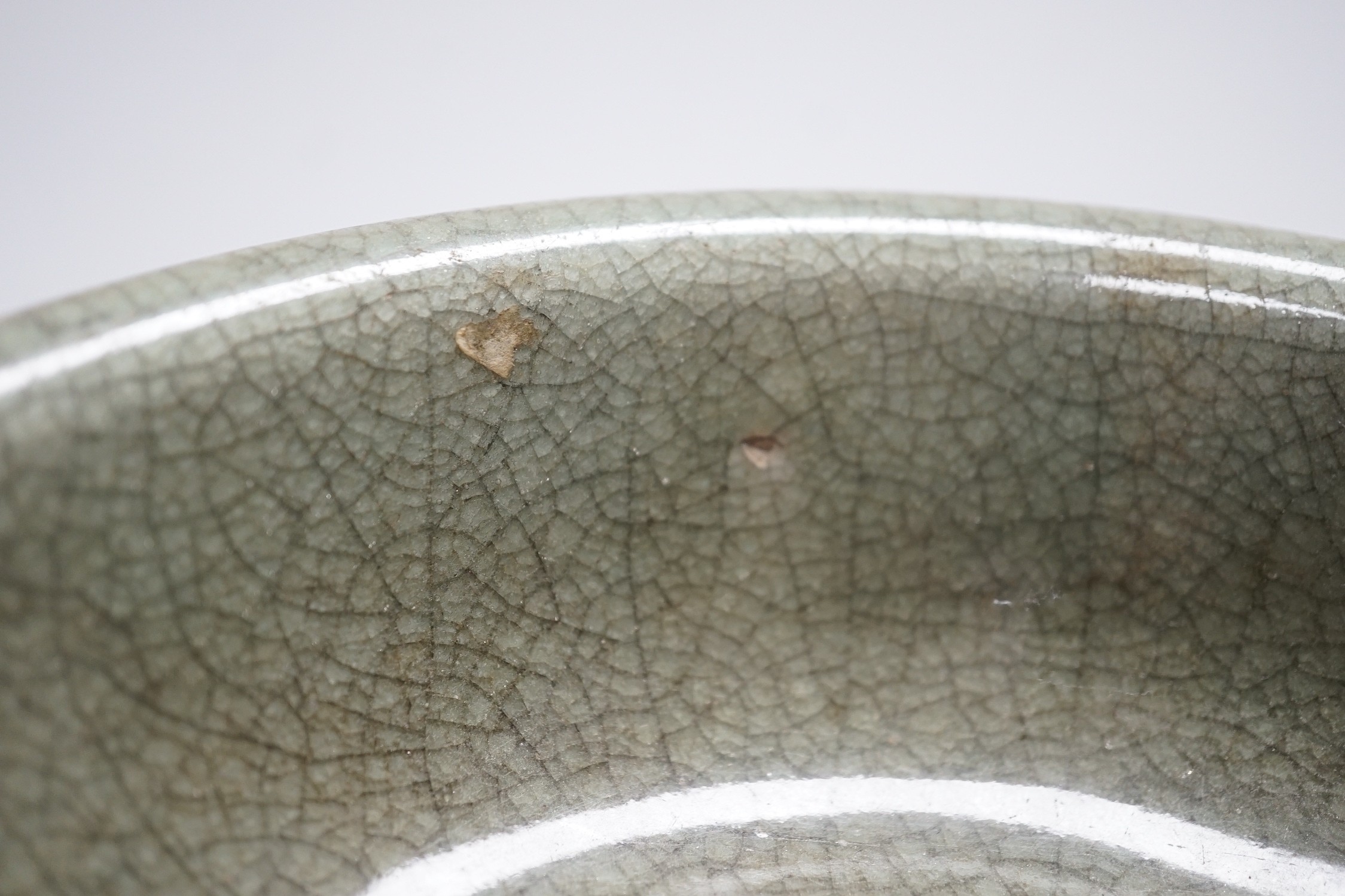 A Chinese Guan type green crackle glaze bowl, early 20th century 19cm diameter, on hardwood stand